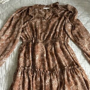 Thin dress size small, but would fit preteens. Long sleeve with built in liner.